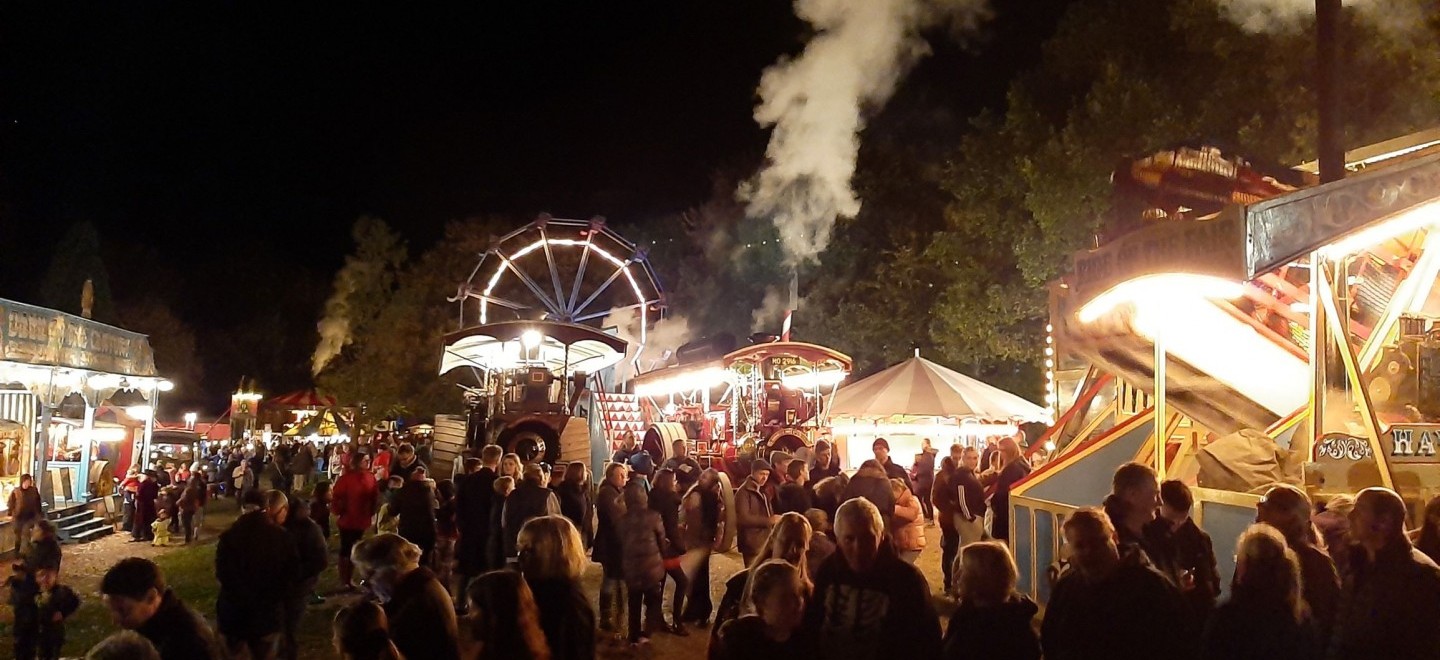 View of the crowd at Hollycombe Fairground at Night